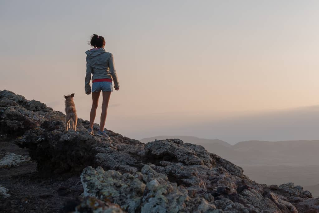 Girl at the Mountain Top with Dog